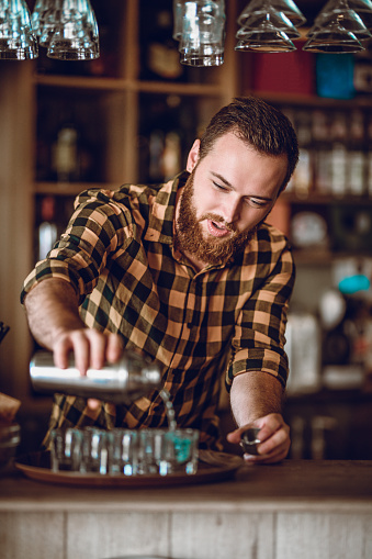 Male Barista Makes Cocktail Shots During Party