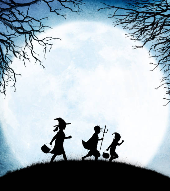 istock Three Children Dressed Up For Halloween Silhouetted Against Moon 1033027992