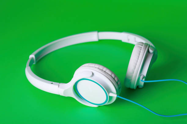 istock Green background and headphones 1033028250