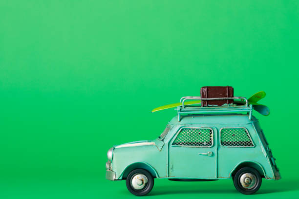 istock Green background and car toys 1033028300