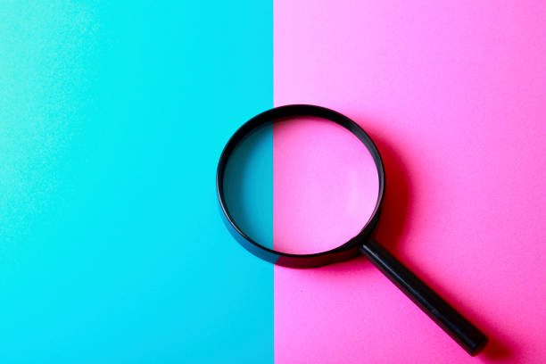istock A colorful background with magnifying glass 1033033860