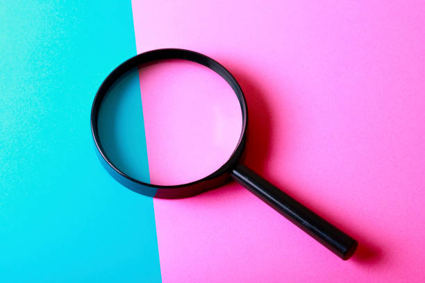 istock A colorful background with magnifying glass 1033033876