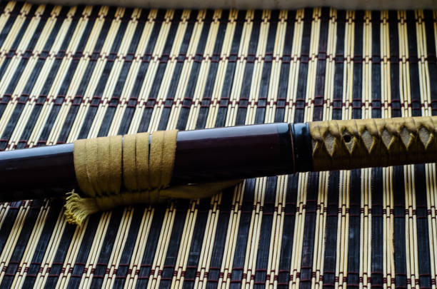 istock Japanese sword katana on bamboo mat 1033034734