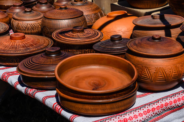 Different wooden pots for sale on a fair stock photo