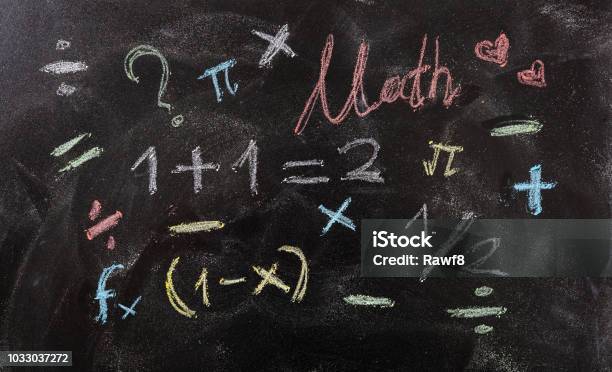 Math Equations And Symbols Isolated On Blackboard Background Stock Photo - Download Image Now