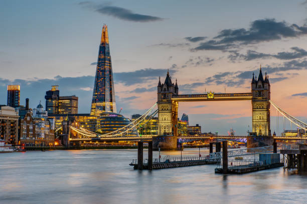 The Tower Bridge in London after sunset The Tower Bridge in London after sunset with the Shard in the back drawbridge photos stock pictures, royalty-free photos & images