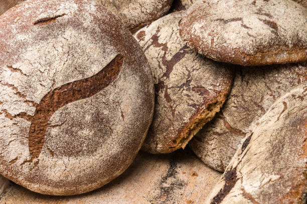istock Bakery - gold rustic crusty loaves of bread 1033045214