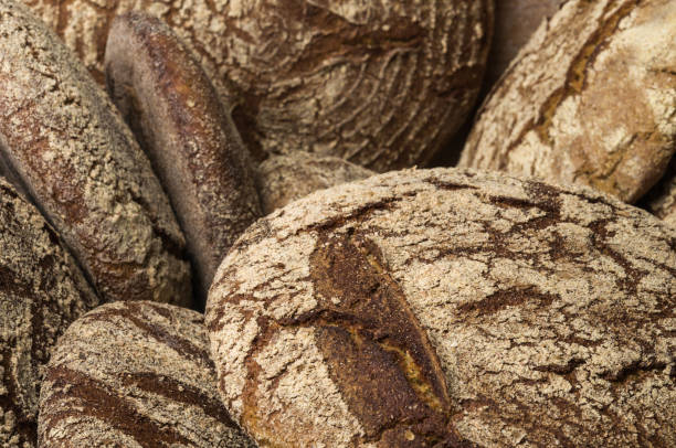 istock Bakery - gold rustic crusty loaves of bread 1033045252