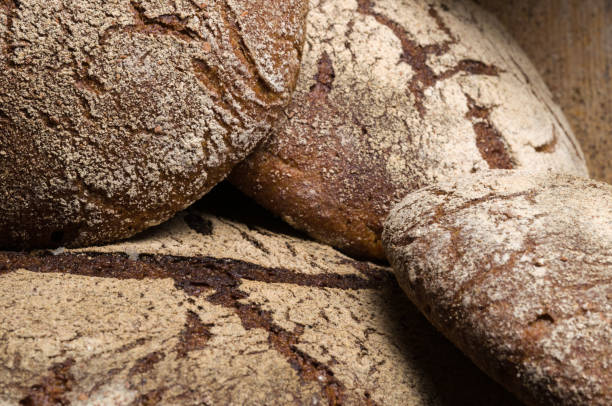 istock Bakery - gold rustic crusty loaves of bread 1033045296