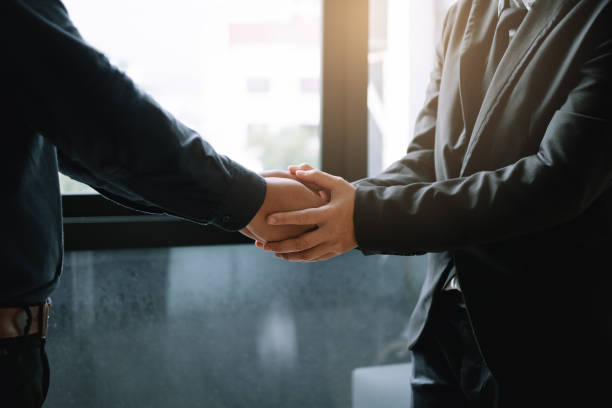 istock Business people holding hands together for support empathy work together. 1033045376