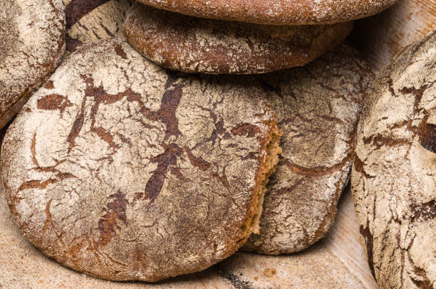 istock Bakery - gold rustic crusty loaves of bread 1033047770