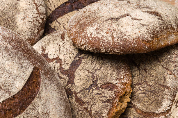 istock Bakery - gold rustic crusty loaves of bread 1033047940