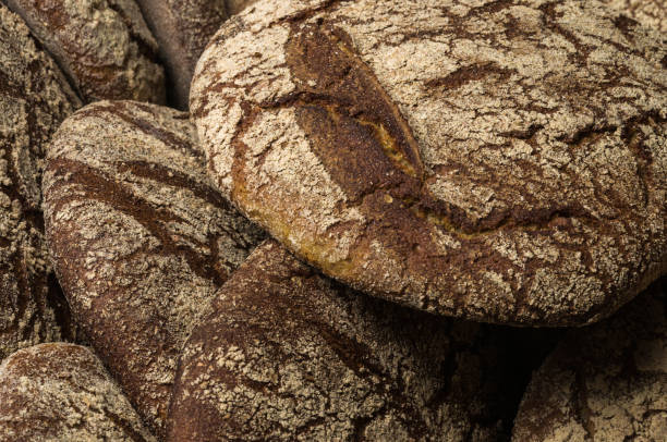istock Bakery - gold rustic crusty loaves of bread 1033048002