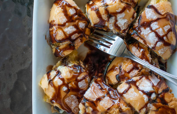 Chocolate and condensed sweet milk crunchy toast cut into pieces on white square bowl