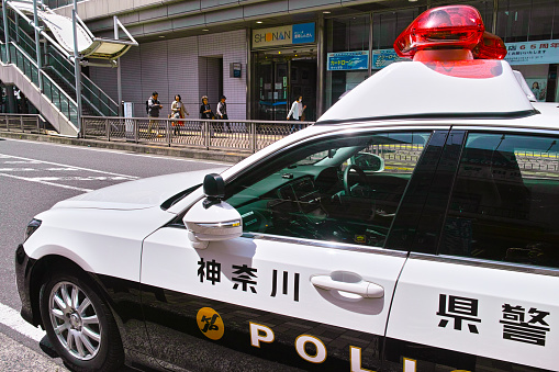 Kamakura, Japan-April 12, 2018: Police car of Kanagawa prefectural police parked on the street on the east exit of Ofuna station.
