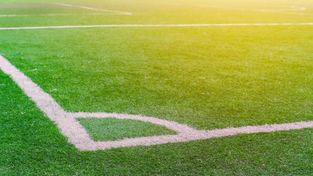 istock White stripe on the green soccer field from top view 1033062816