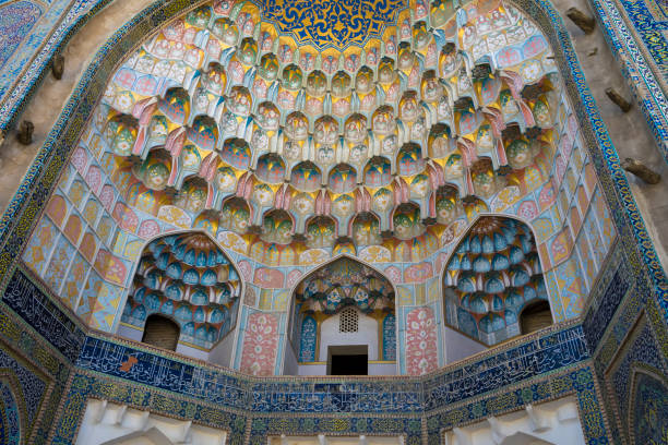 istock Decorative patterns and architectural details at the main entrance of Abdullaziz Khan madrasah in Bukhara, Uzbekistan 1033078024