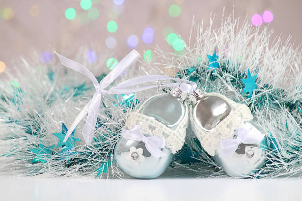istock New Year or Christmas decorations on an abstract background, bokeh effect. White tinsel with turquoise stars. Can be used as wallpaper or greeting card. Selective focus, copy space. 1033078366
