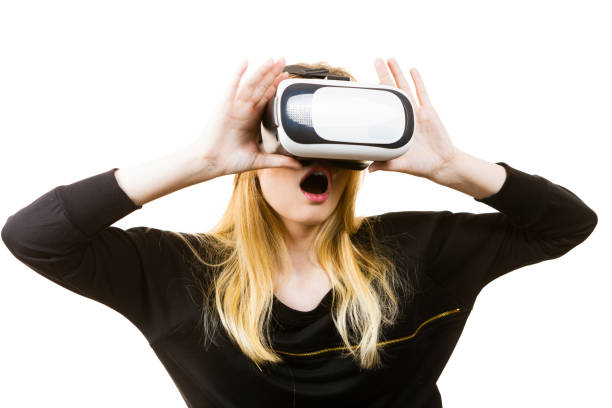 istock Woman wearing VR goggles 1033087338
