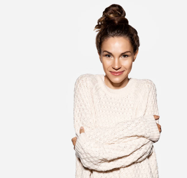 istock Young brunette woman dressed in cozy knitted sweater 1033093370