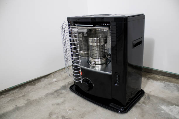 istock Black kerosene heater in a white background composition 1033093958