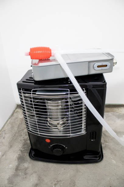 istock Black kerosene heater in a white background composition 1033093980