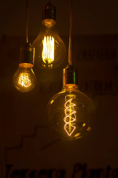 Filament bulbs lit in the dark stock photo