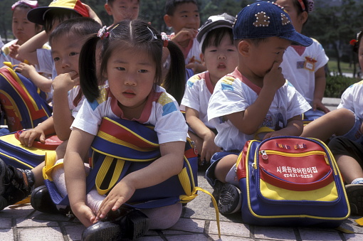children at a monument of the Korean War Memorial in the city of Seoul in South Korea in EastAasia.  Southkorea, Seoul, May, 2006