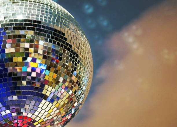 istock Shiny mirror ball with colorful highlights at the disco. 1033122978