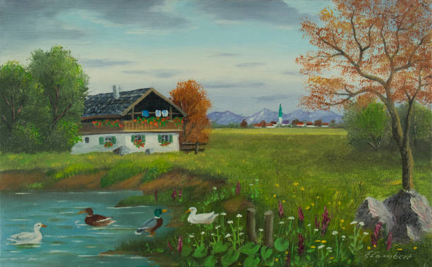 istock Ducks by the pond with a house in front of a village 1033127828