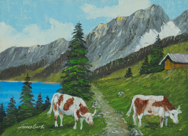 istock Mountain landscape with lake and cows in the foreground 1033128136