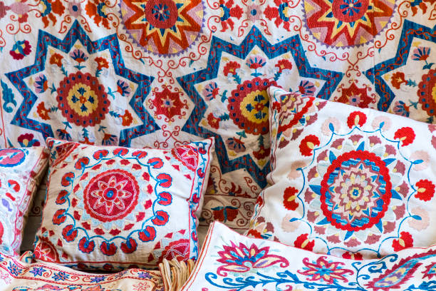 Market stalls with decorative tribal textile with colourful pattern made in Central Asia, Uzbekistan. Market stalls with decorative tribal textile with colourful pattern made in Central Asia, Uzbekistan. bukhara stock pictures, royalty-free photos & images