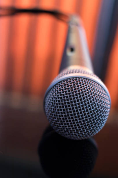 istock Singers concert stage hand held microphone for singing and presentations or voiceovers. 1033134468