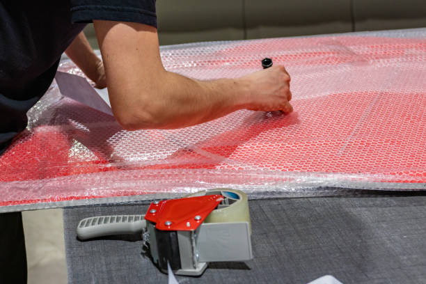 istock Quick hands stacking and ordering piles of panels ready for shipment. Expertise and passion. 1033153234