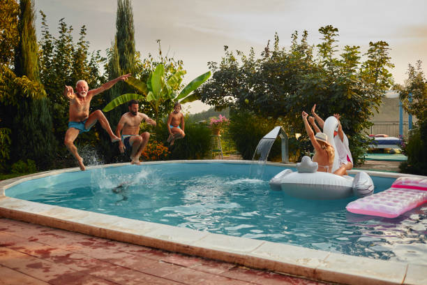 istock Multi generation family having fun on the pool 1033154186