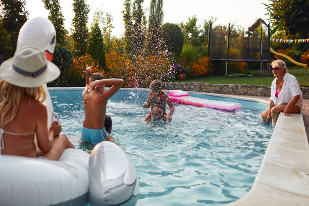 istock Multi generation family having fun on the pool 1033156974
