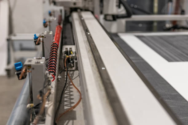istock Cnc machine details while printing and cutting rigid panels for exhibition commercial booth. 1033157190