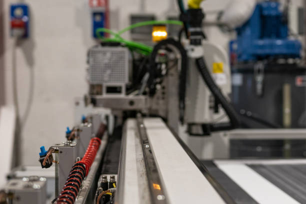 istock Cnc machine details while printing and cutting rigid panels for exhibition commercial booth. 1033157246