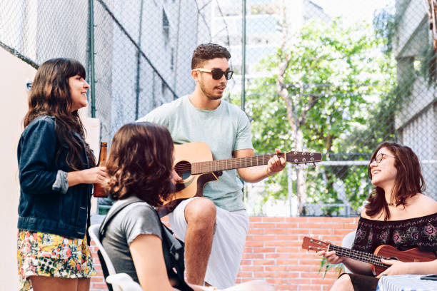 istock Young friends having music time at a party 1033157492