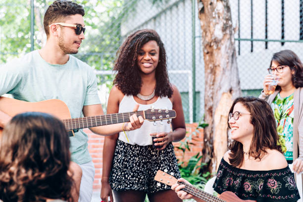 istock Young friends having music time at a party 1033157754