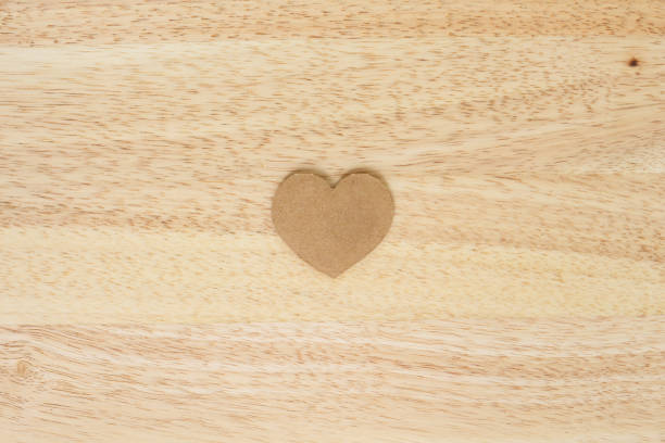istock valentine paper heart on wood background 1033157798