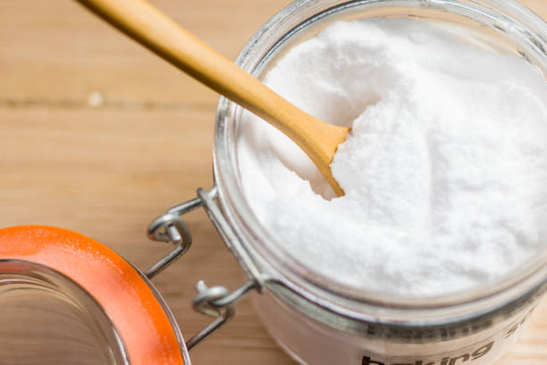 istock baking soda on wooden table 1033164476