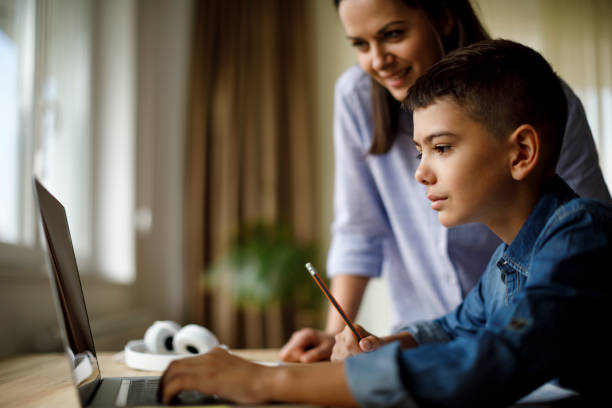 istock Mother helping teenager with homework 1033164834