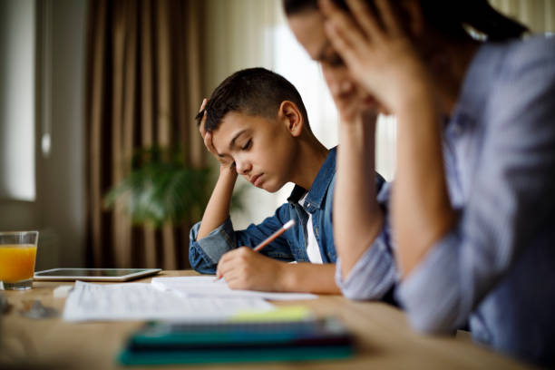 istock Teenage boy having problems in finishing homework 1033164868