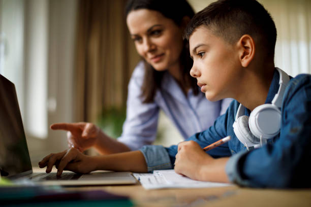istock Mother helping teenager with homework 1033164926