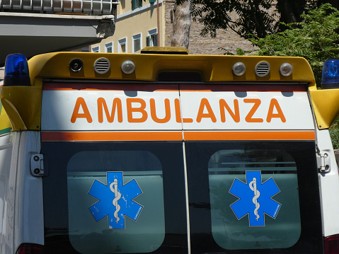 Rome, Italy - July 31, 2018: Italian Emergency Mobile Unit ambulance moving on a street in Rome during the day