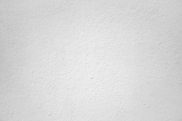 istock Old  gray cement or concrete wall. Grunge white plastered stucco textured background. 1033168244