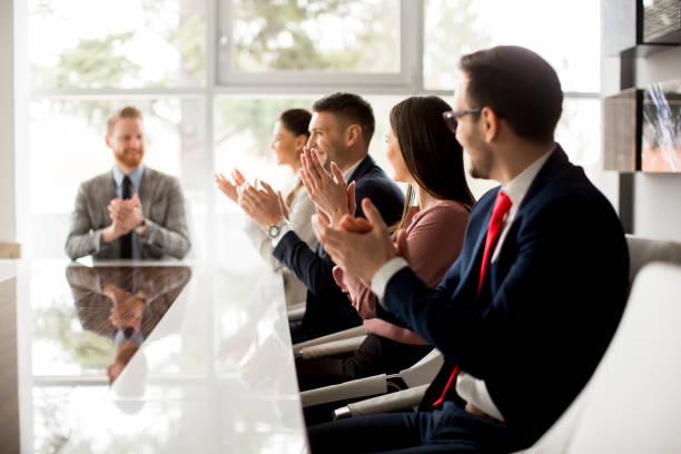 istock Businesspeople applauding while in a meeting at office 1033168324