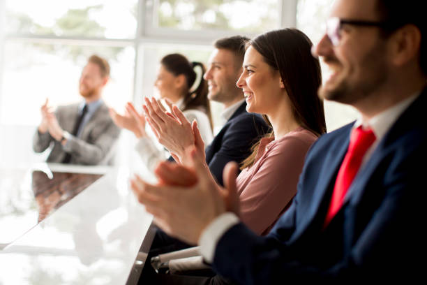 istock Businesspeople applauding while in a meeting at office 1033168326