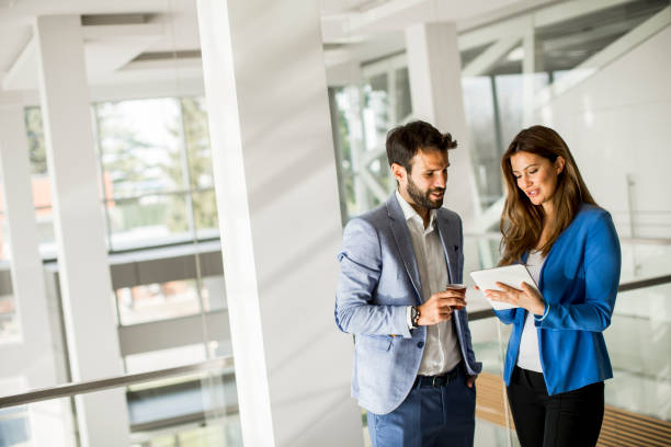 istock Young business people standing in the office 1033170934